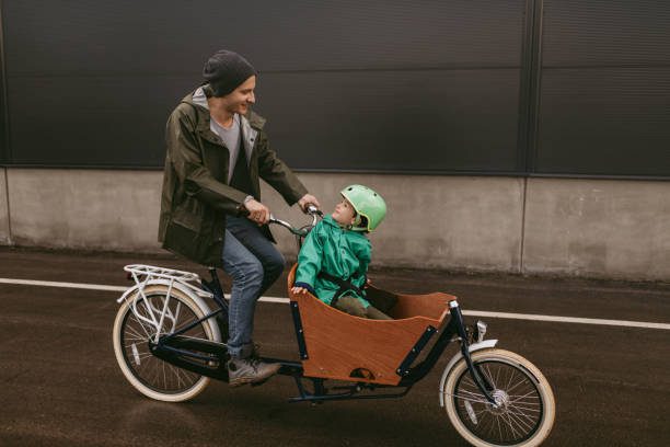 Father and son having a ride with cargo bike