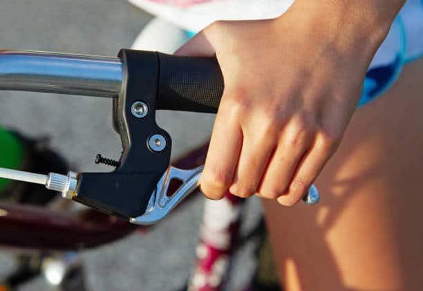 hand on e-bike brake lever