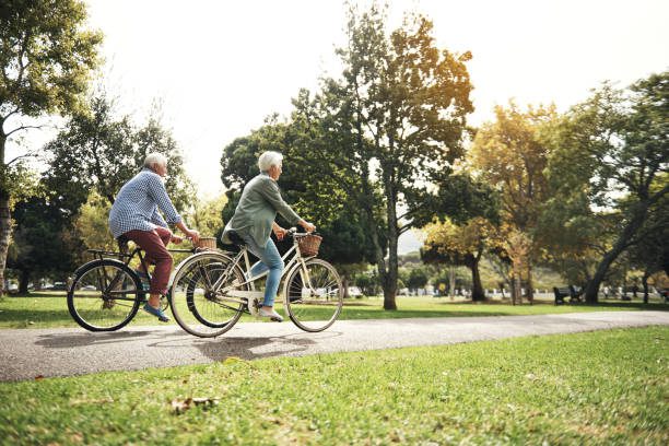 Shot of a senior couple going for a bicycle ride in the park