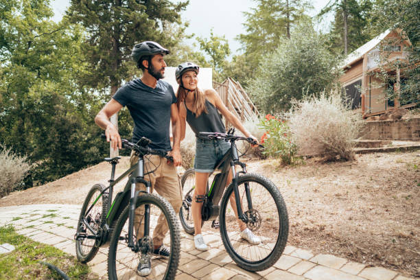 happiness couple with mountain ebike outdoors